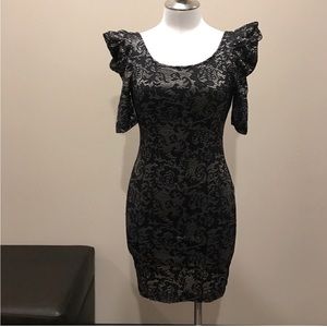 Backless fitted black and gold dress